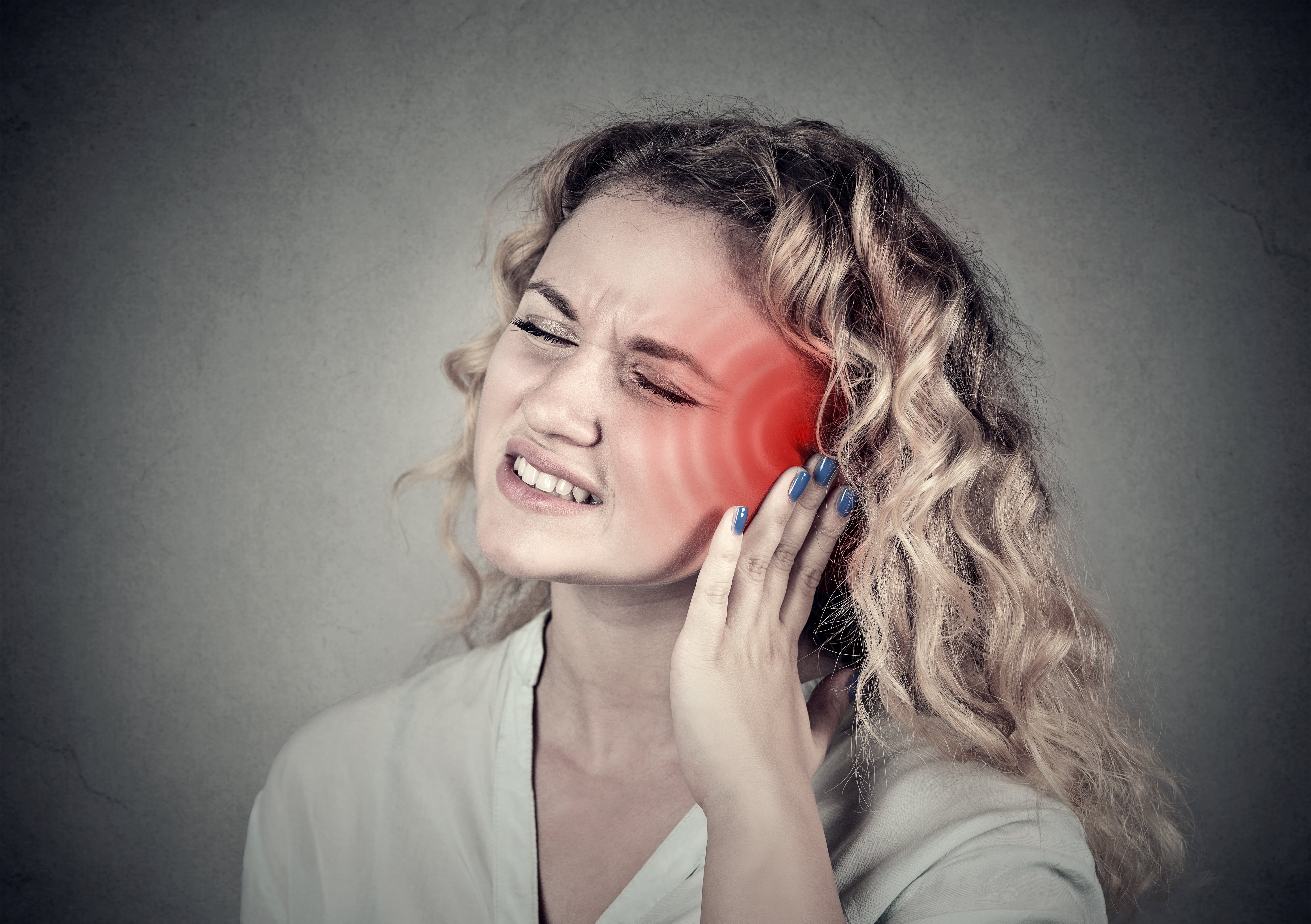 Adobe ENT - Tinnitus Sick female having ear pain touching head Adobe ENT - Tinnitus Sick female having ear pain touching head